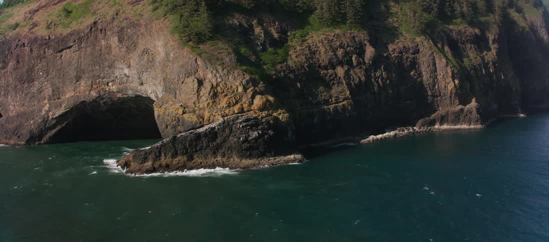 Waves crash against the rocky shore