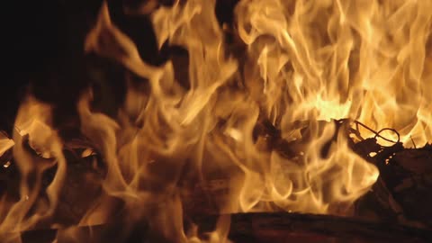 A fire is burning at night