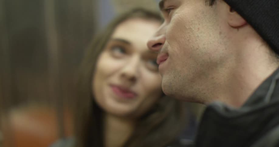 Girl and boy talk on bus
