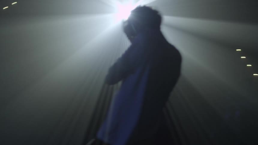 Man blinded by bright spotlight