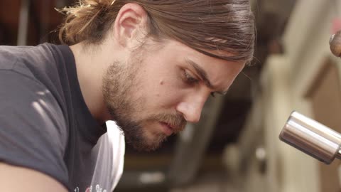 A man concentrates while he works