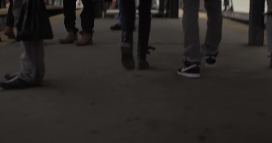 Close cropped shot of feet of people walking