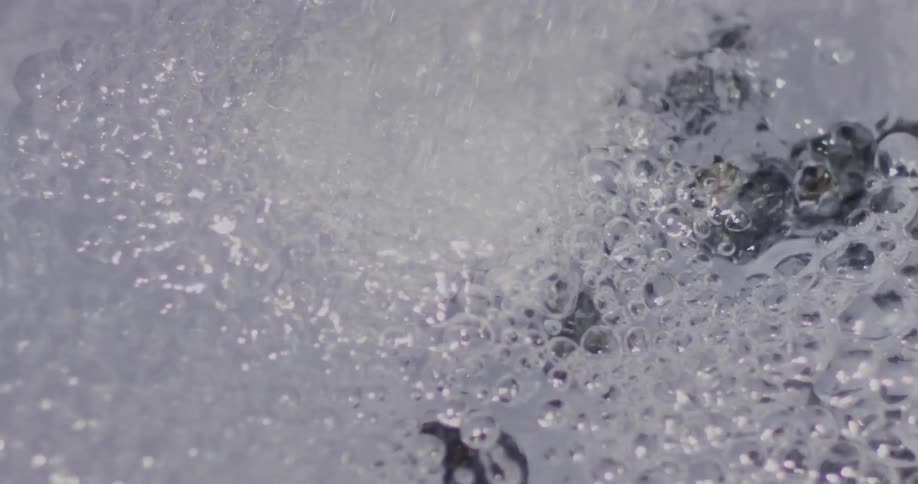 Water flows down a drain