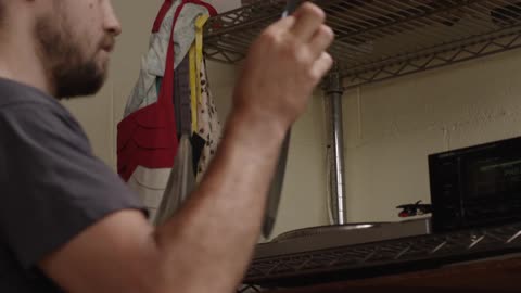 Man pulls out a record and plays it