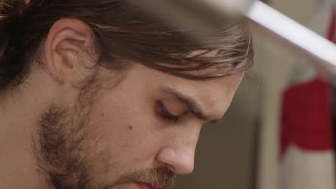 A man looks at something in his hands