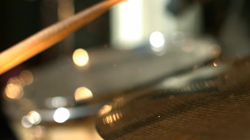 Drumstick striking a cymbal