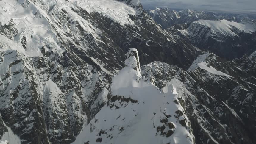 Peaks of mountains are covered with snow