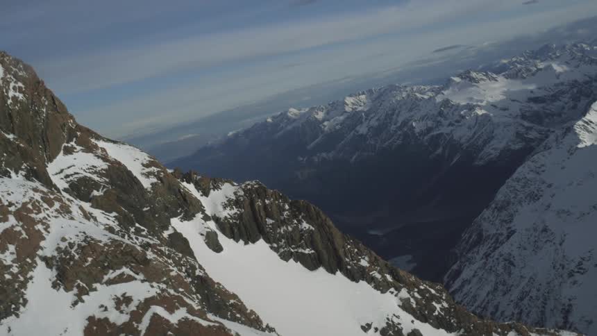 Aerial view over a snow covered mountainous region