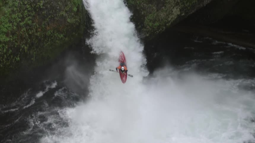 Real time shot of a kayaker running punchbowl falls before the large wildfire consumed the trees in the area