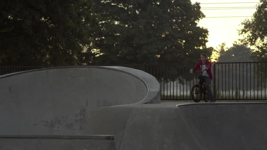 Man on bicycle at a skatepark