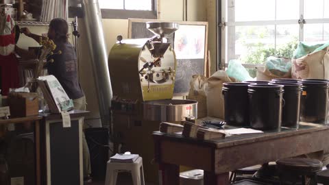 Woman in shop turning record over