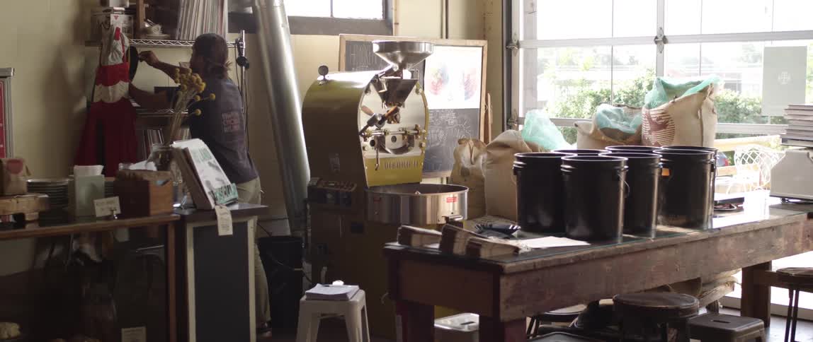 Woman in shop turning record over