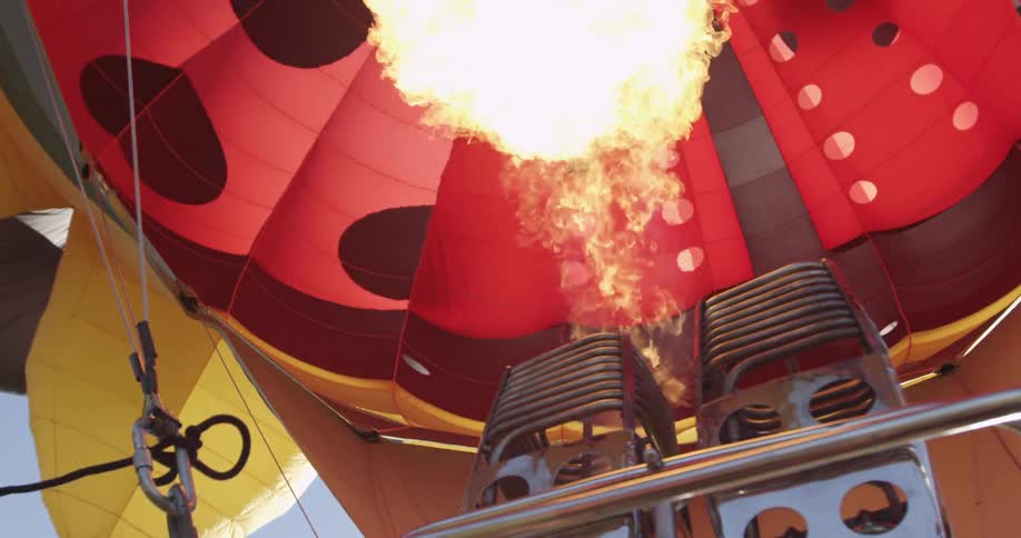 A flame flares up inside a hot air balloon