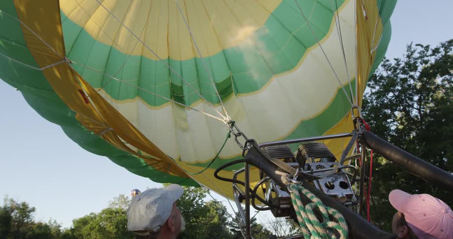 A person filling a hot air balloon