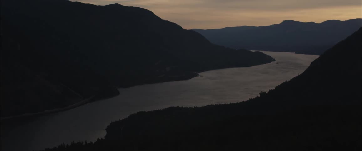 River running through the mountains and sunrise
