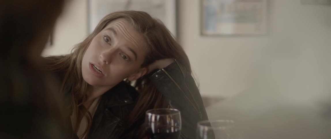 Woman drinking wine with a friend