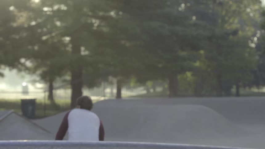 A man jumps and rotates on a bicycle