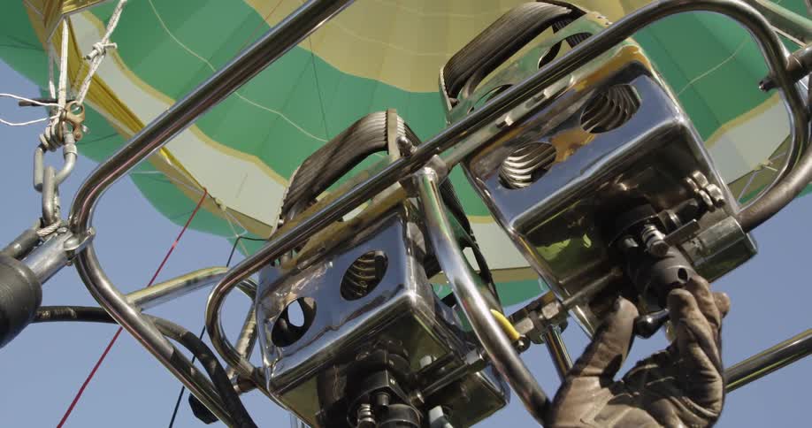 Person turns on the fire mechanism in a hot air balloon