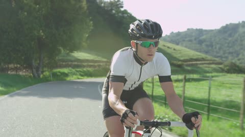 Man bikes down country road