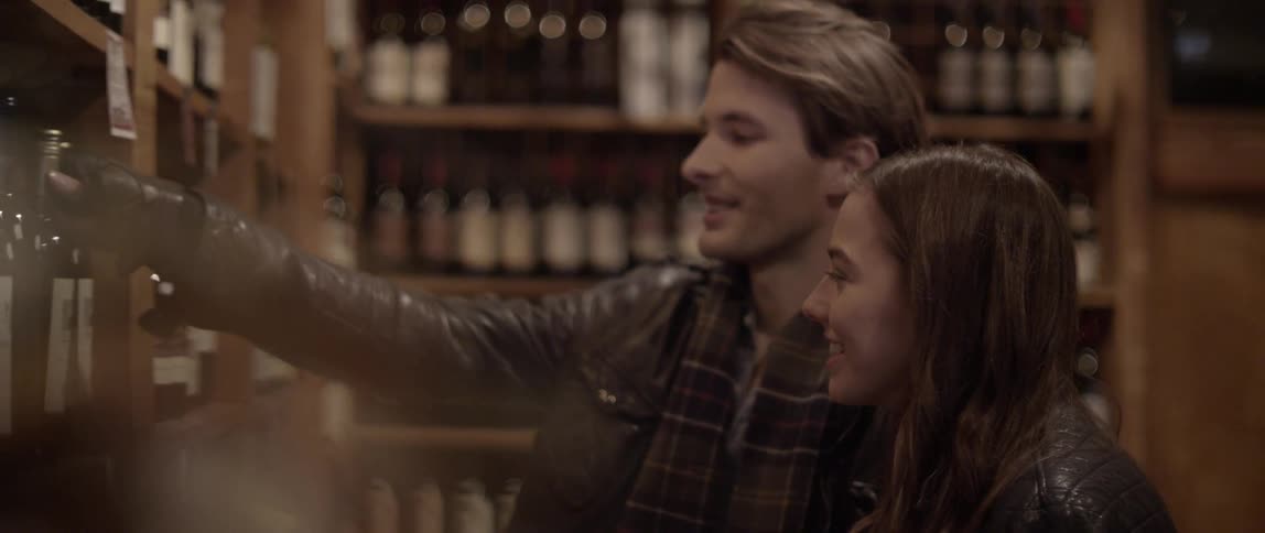 Man and woman choosing wine in a shop