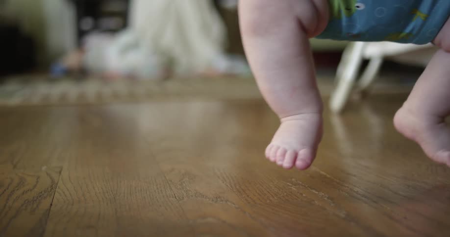 Baby feet touching the floor from bouncing