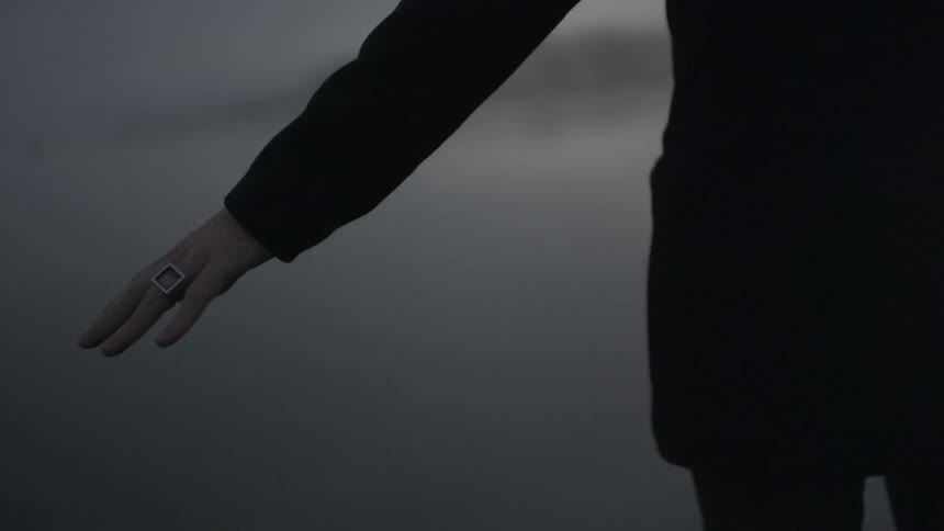 An hand with a ring is outstretched