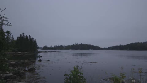 A person canoes on a body of water