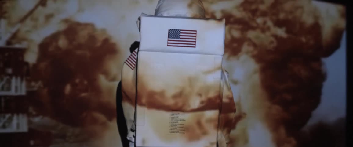 An explosion is projected onto an astronaut