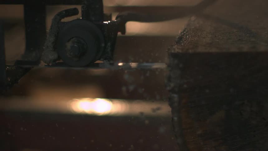 A saw cutting wood