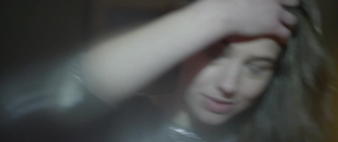 A person standing in front of a strobe light