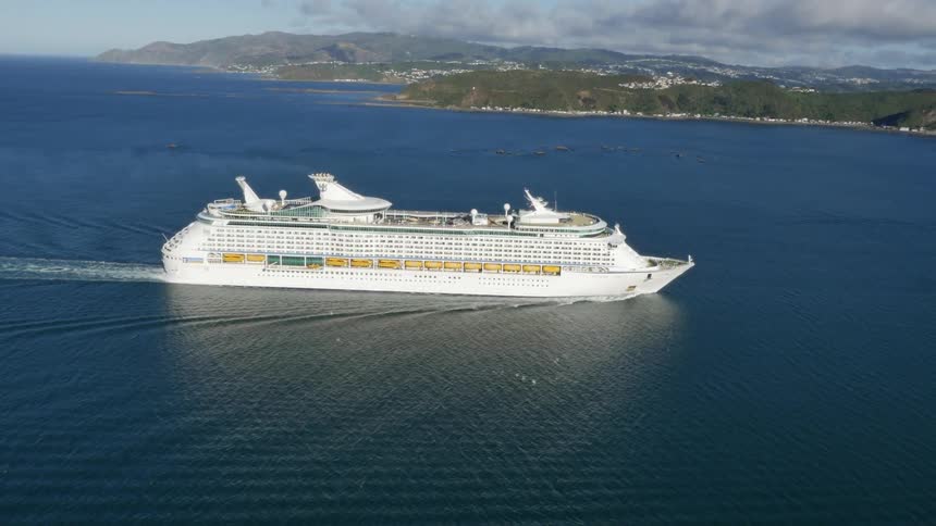 Cruise ship sailing across a placid body of water