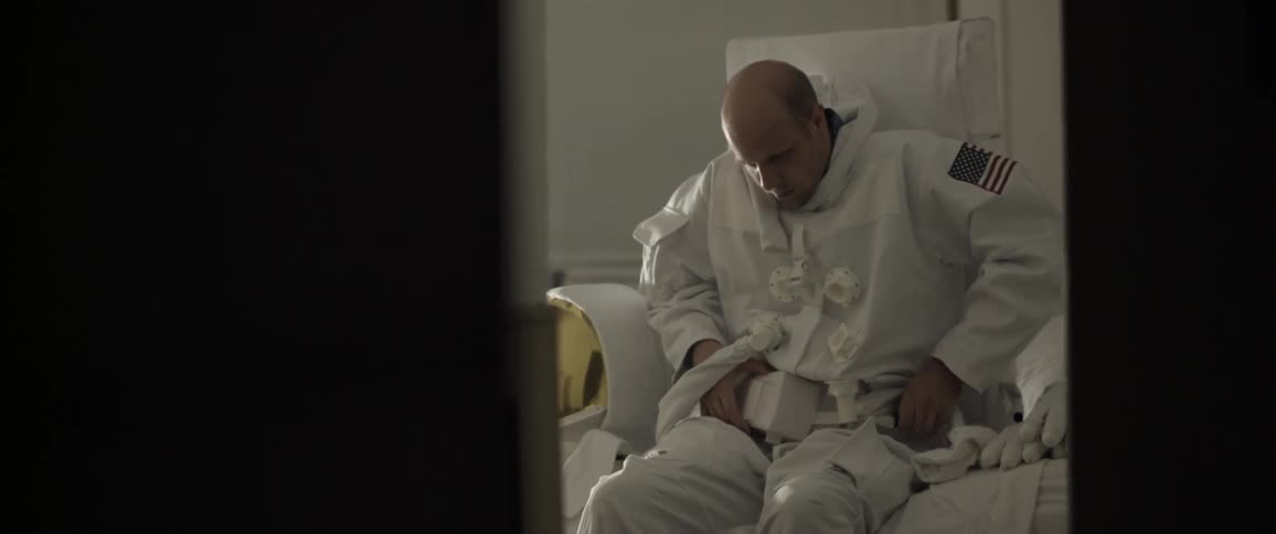 An astronaut removing his space suit