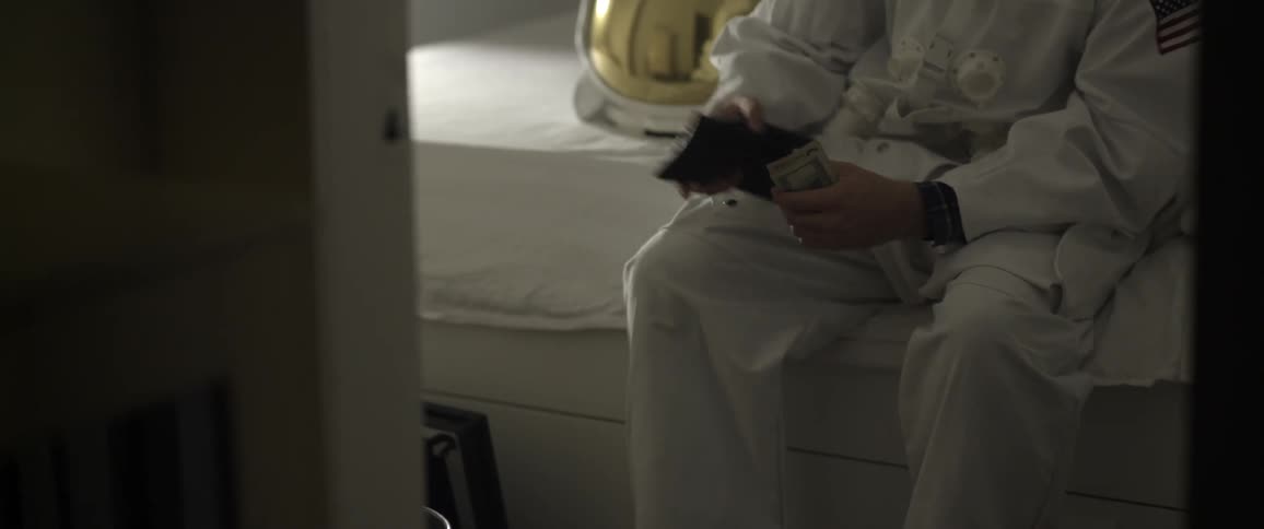 A person putting money in their wallet