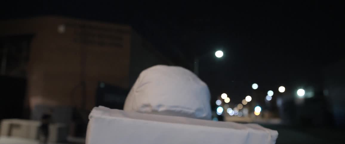 A person walking around a street in an astronaut costume