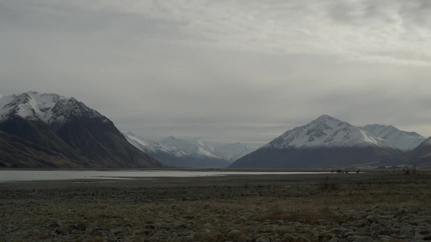 A range of mountains with snow covered tops