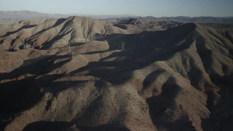 The tops of barren mountains as far as can be seen