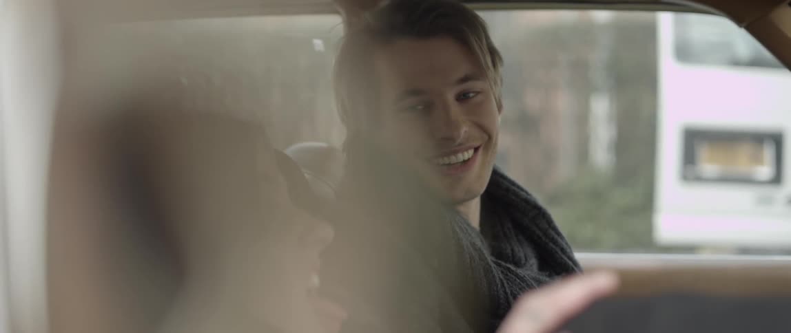 People sitting inside of a car