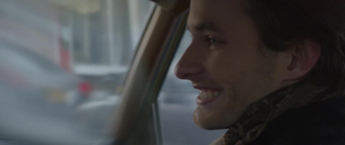 Passenger in a car smiling and laughing