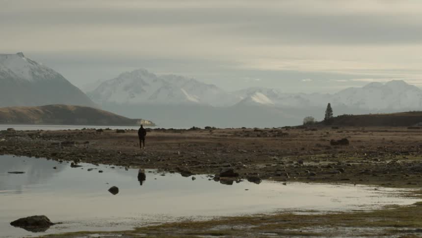 A person walks alone in a remote region
