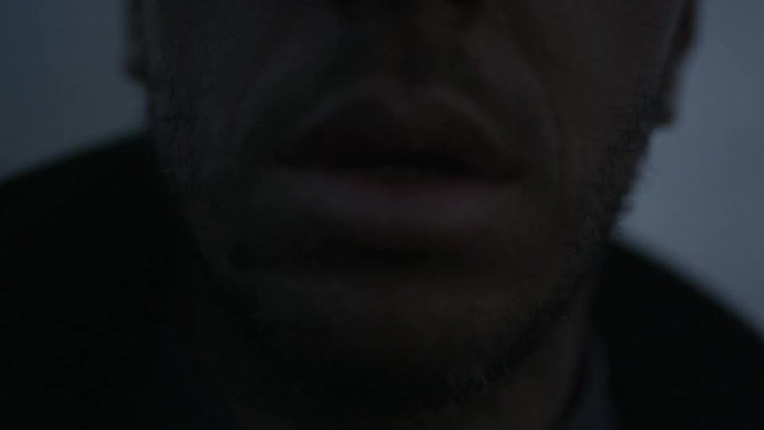 A close up of a man's mouth
