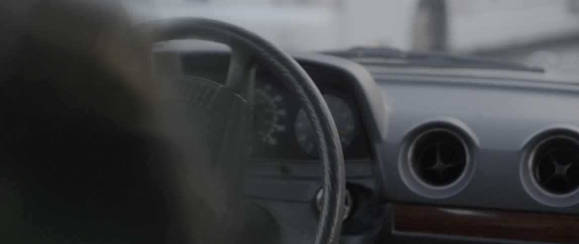 Woman drives the car on the highway in the street