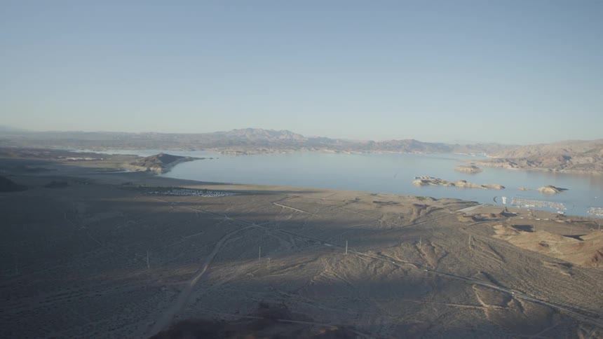 Aerial view of some desolate land with a large lake in the center