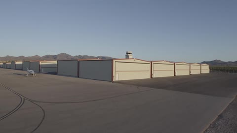 An airplane is parked on concrete