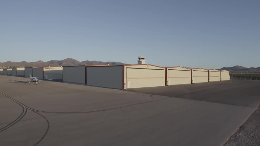 An airplane is parked on concrete