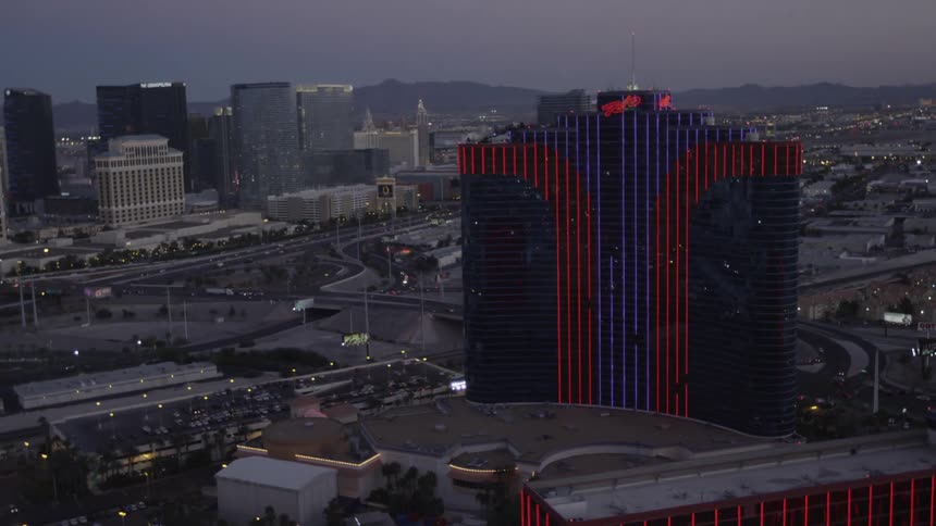 A hotel looms in a cityscape