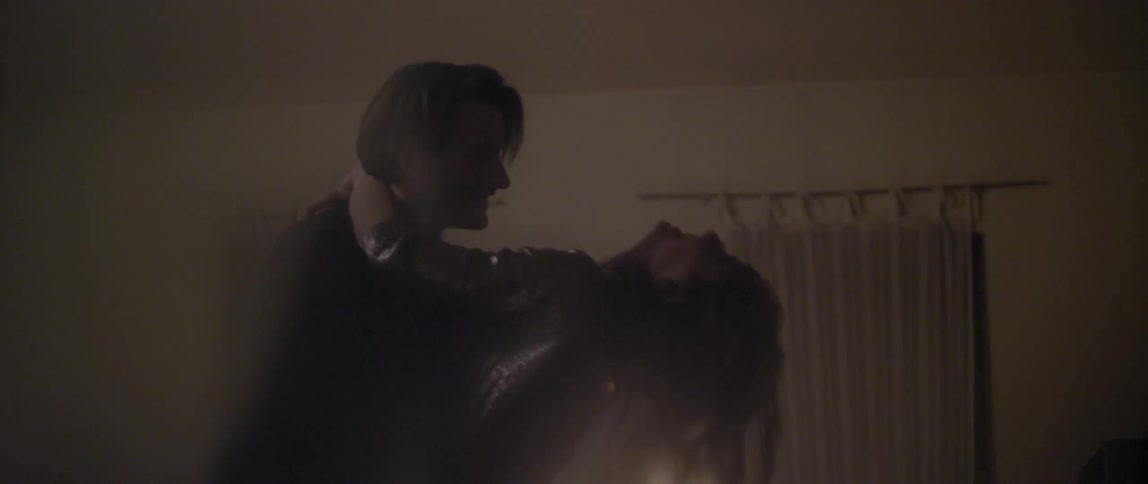 A young man and woman happy and embracing as they dance