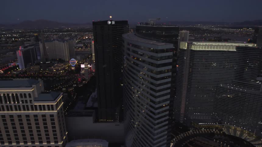 Buildings stand tall in a city at night