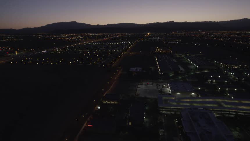 A city is shown from above at night