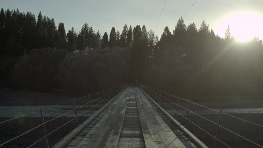 Slowly crossing a wooden bridge
