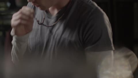 A guy takes his shirt off